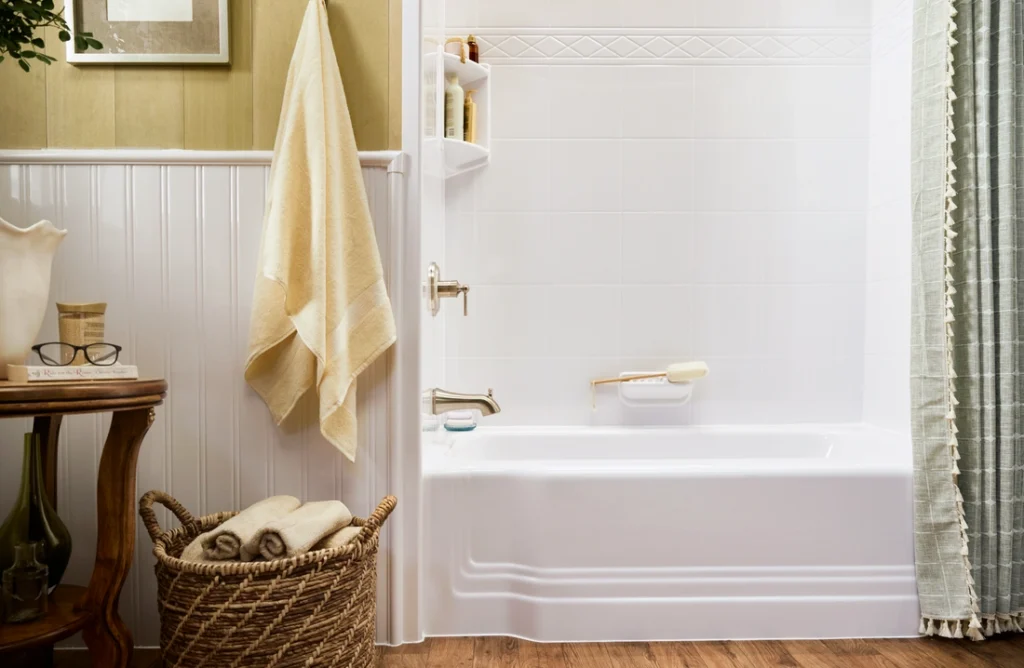 French country style bathroom renovation featuring white bathtub surround and rustic farmhouse accents