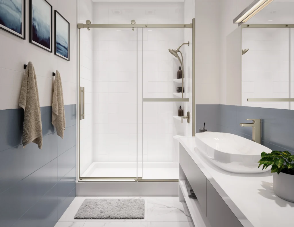 Modern bathroom featuring a custom white acrylic shower with sliding glass door, blue-gray tile walls, and brushed nickel fixtures